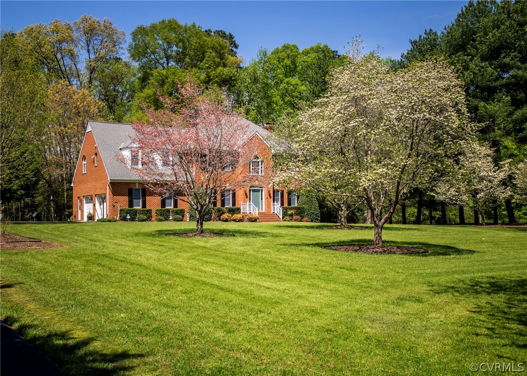 11239 Hanover Courthouse Road Hanover, VA 23069 - Photo 49 of 50 a view of a big house with a big yard and large trees