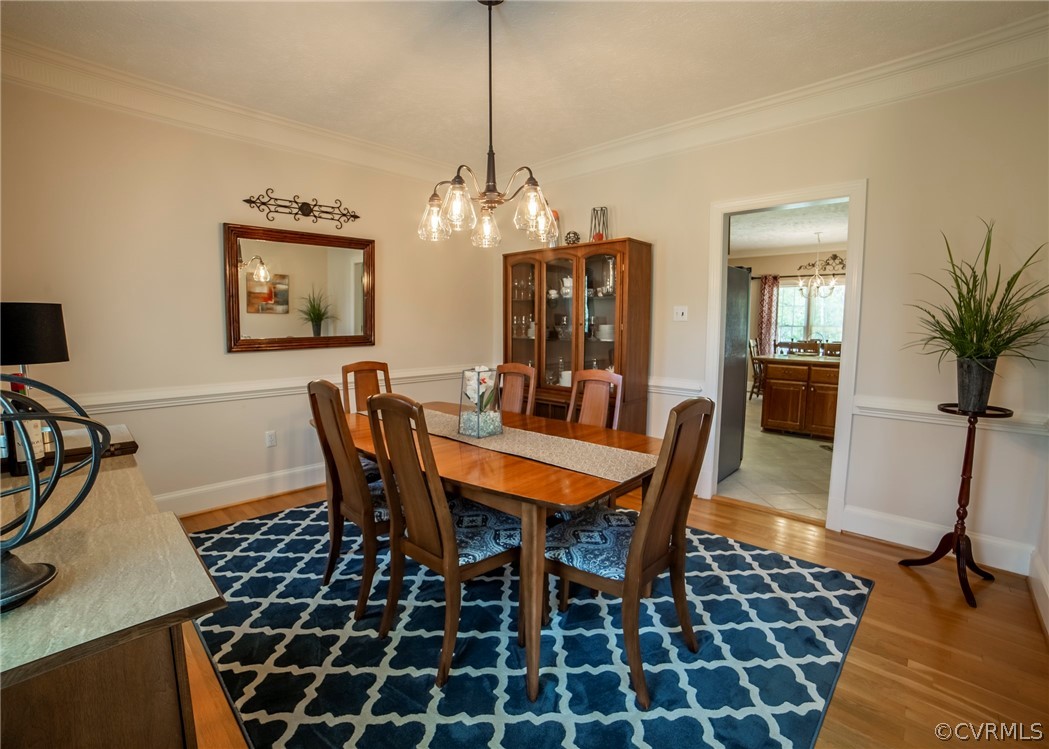11239 Hanover Courthouse Road Hanover, VA 23069 - Photo 9 of 50 a dining room with a table and chairs