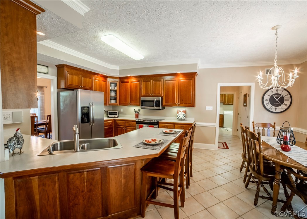 11239 Hanover Courthouse Road Hanover, VA 23069 - Photo 10 of 50 a large kitchen with a table and chairs