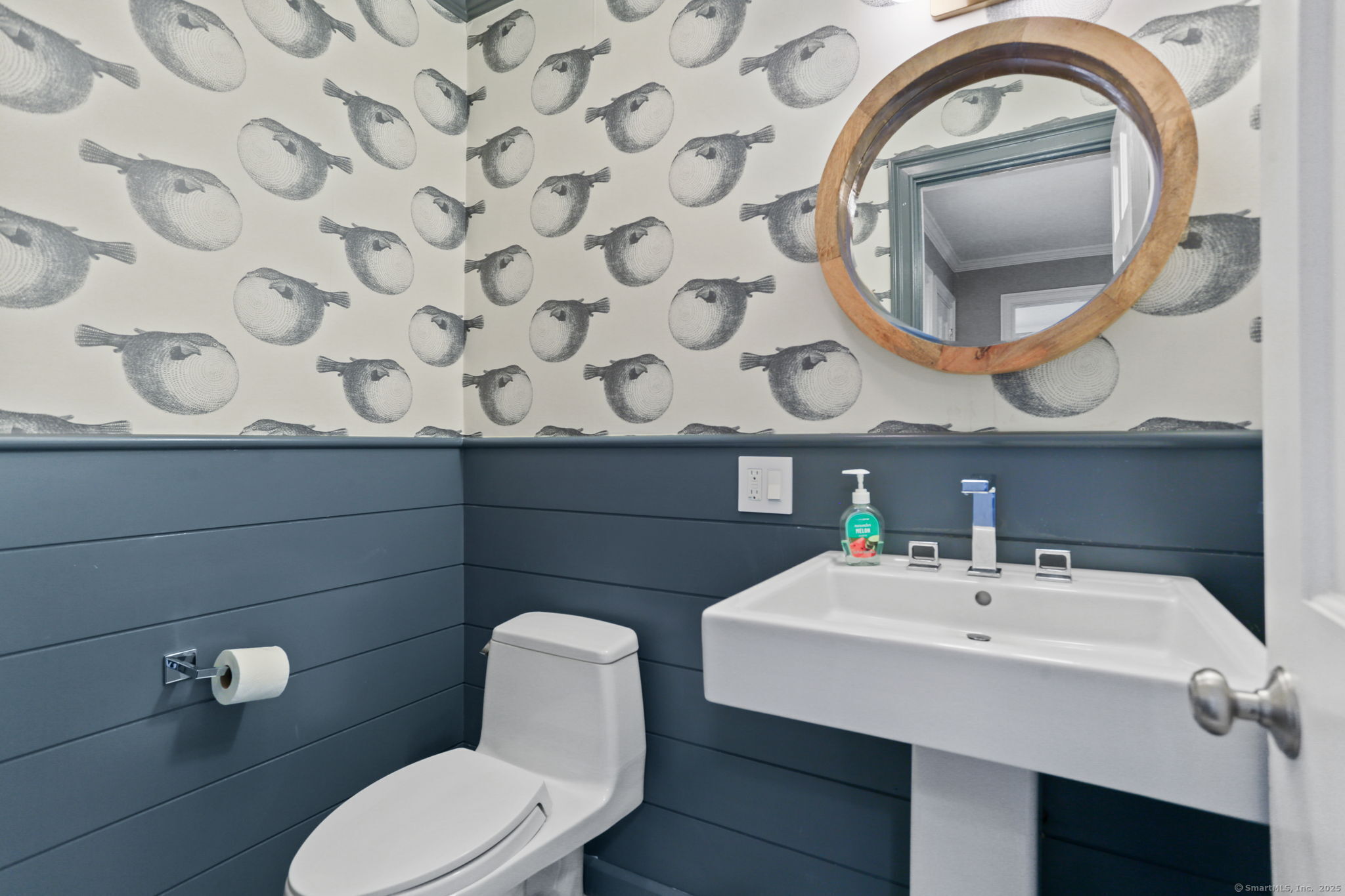 31 White Birch Road Weston, CT 06883 - Photo 19 of 37 a bathroom with a toilet a sink and mirror