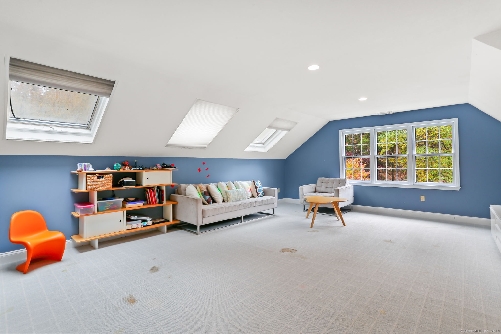 31 White Birch Road Weston, CT 06883 - Photo 23 of 37 a living room with lots of furniture and a window