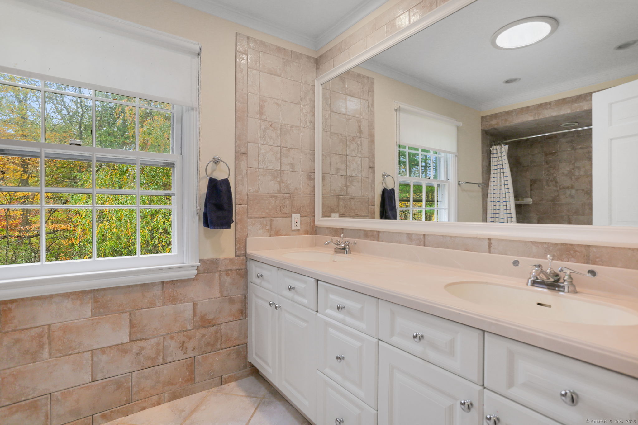 31 White Birch Road Weston, CT 06883 - Photo 27 of 37 a bathroom with a sink and a mirror