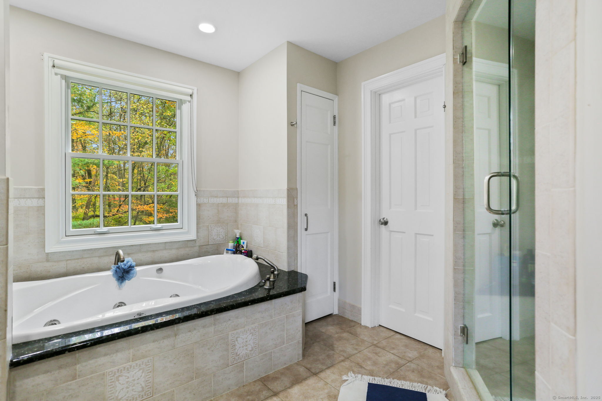 31 White Birch Road Weston, CT 06883 - Photo 29 of 37 a bathroom with a tub and a sink