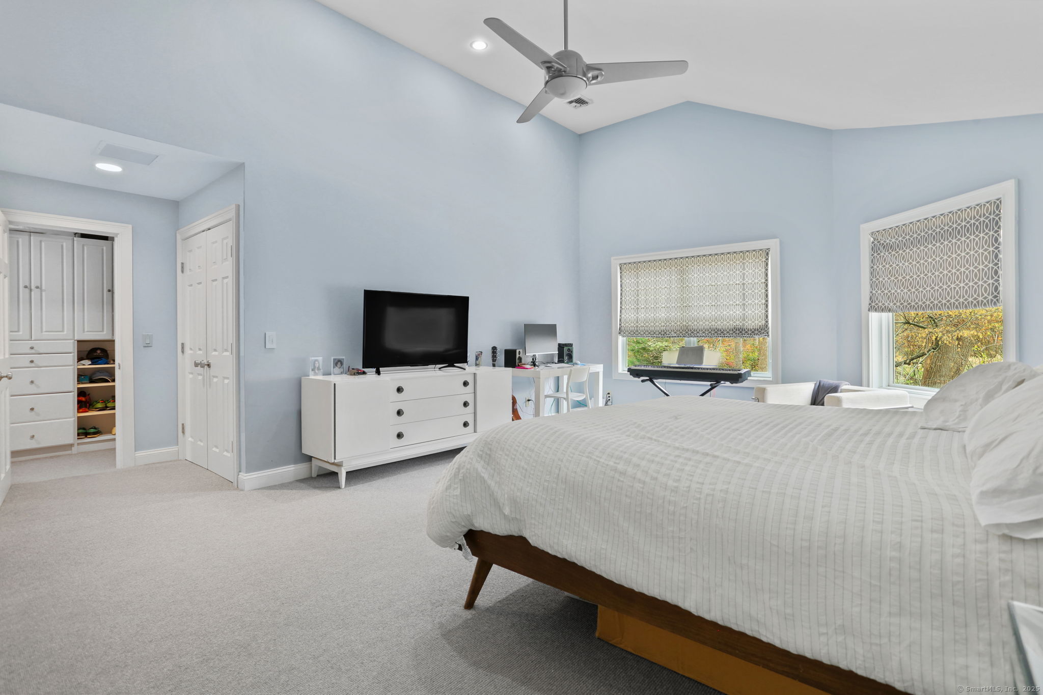 31 White Birch Road Weston, CT 06883 - Photo 30 of 37 a living room with furniture and a flat screen tv