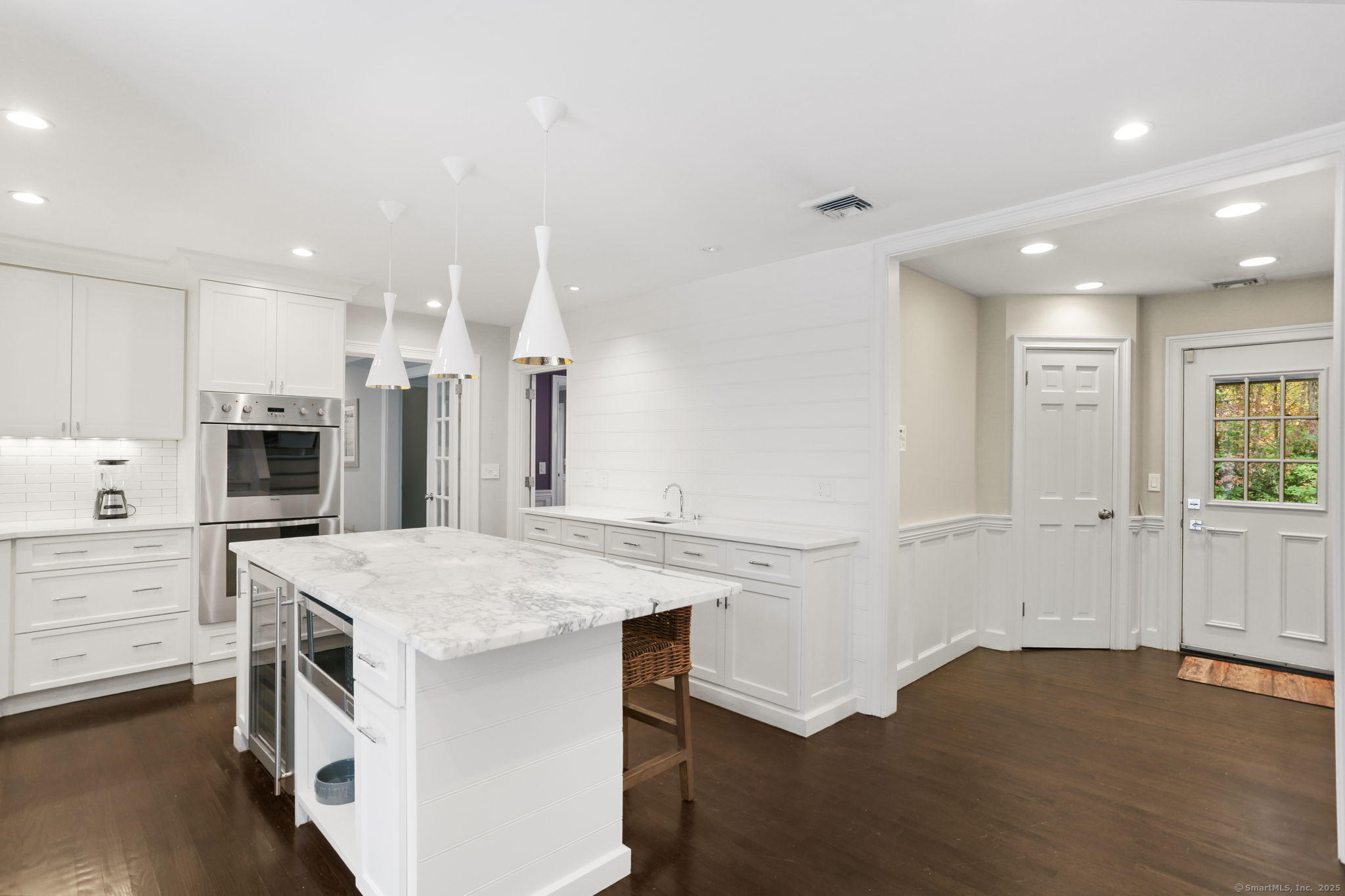 31 White Birch Road Weston, CT 06883 - Photo 5 of 37 a kitchen that has a lot of white cabinets and stainless steel appliances