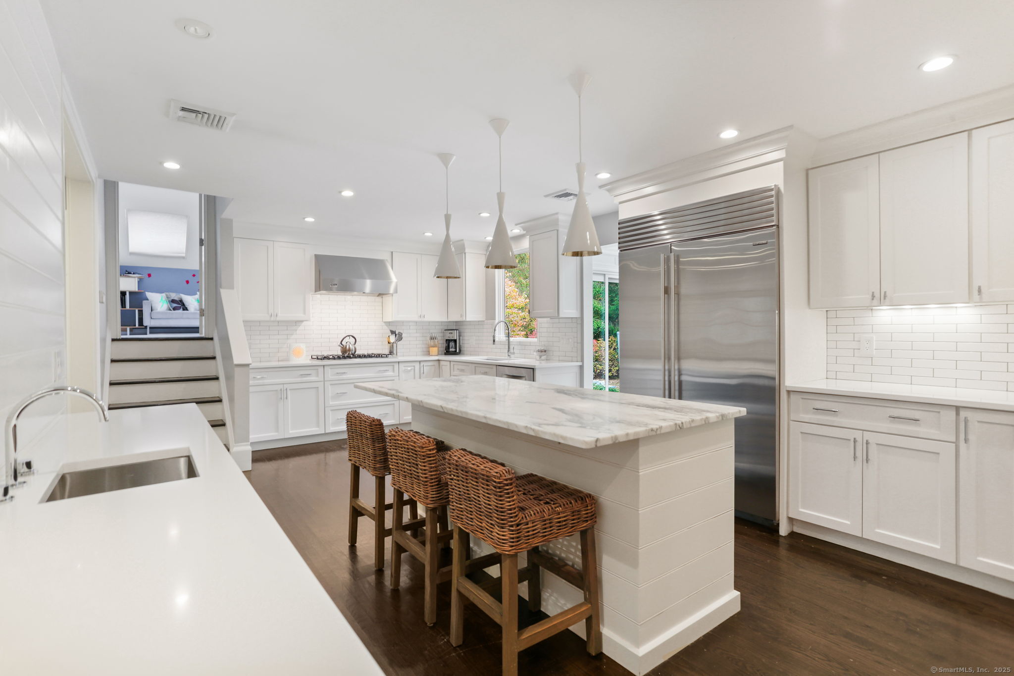 31 White Birch Road Weston, CT 06883 - Photo 9 of 37 a kitchen with counter top space sink and refrigerator