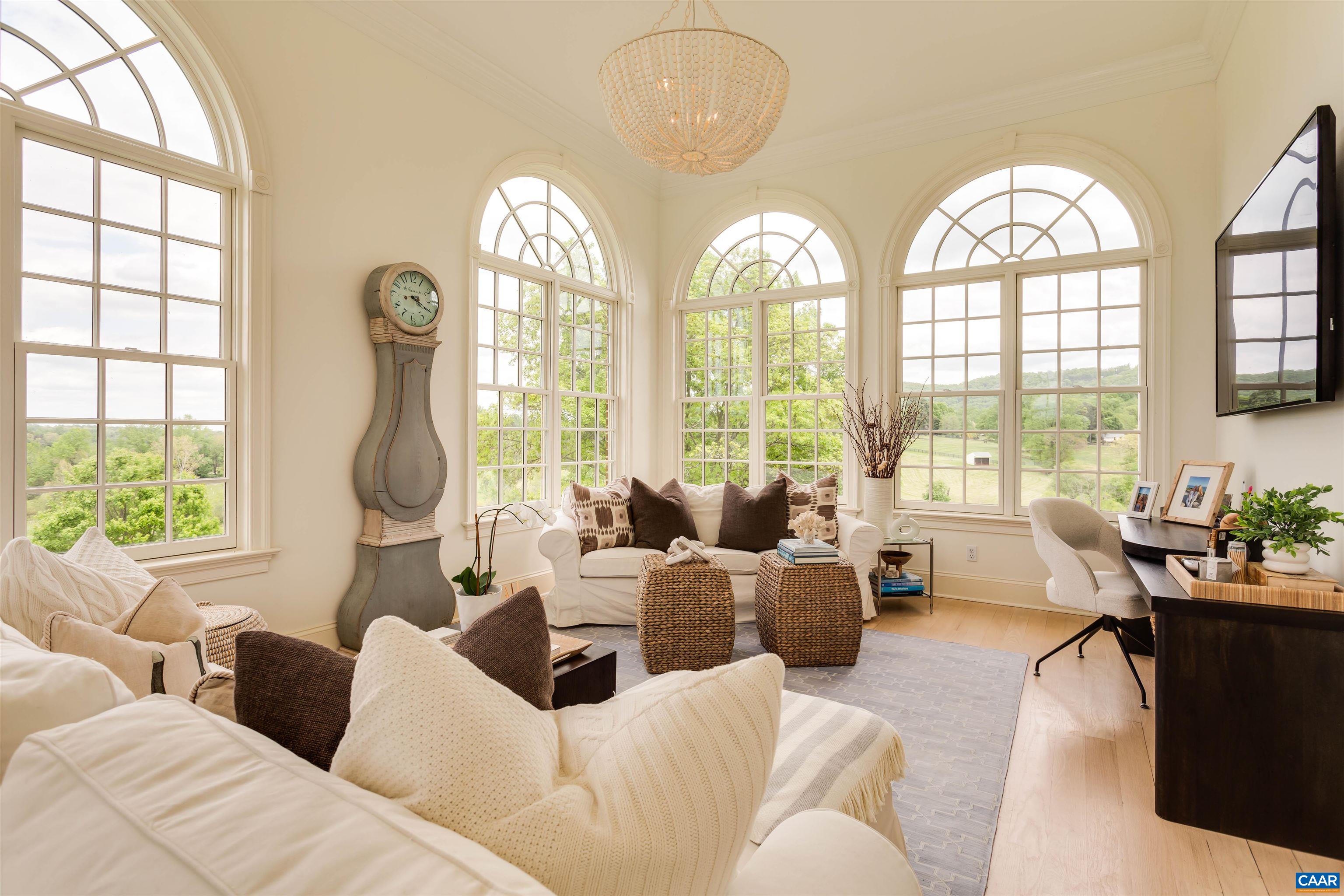 585 Ragged Mountain Drive Charlottesville, VA 22903 - Photo 11 of 60 a living room with furniture and a large window