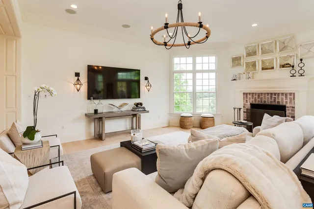 a kitchen with cabinets a sink dishwasher a dining table and chairs with wooden floor