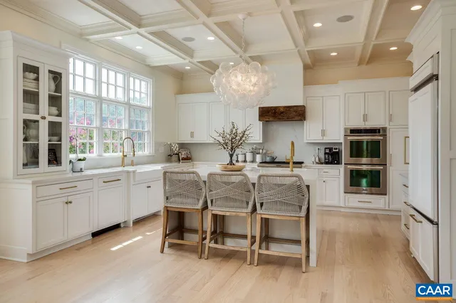 a view of a hallway with paintings on the wall