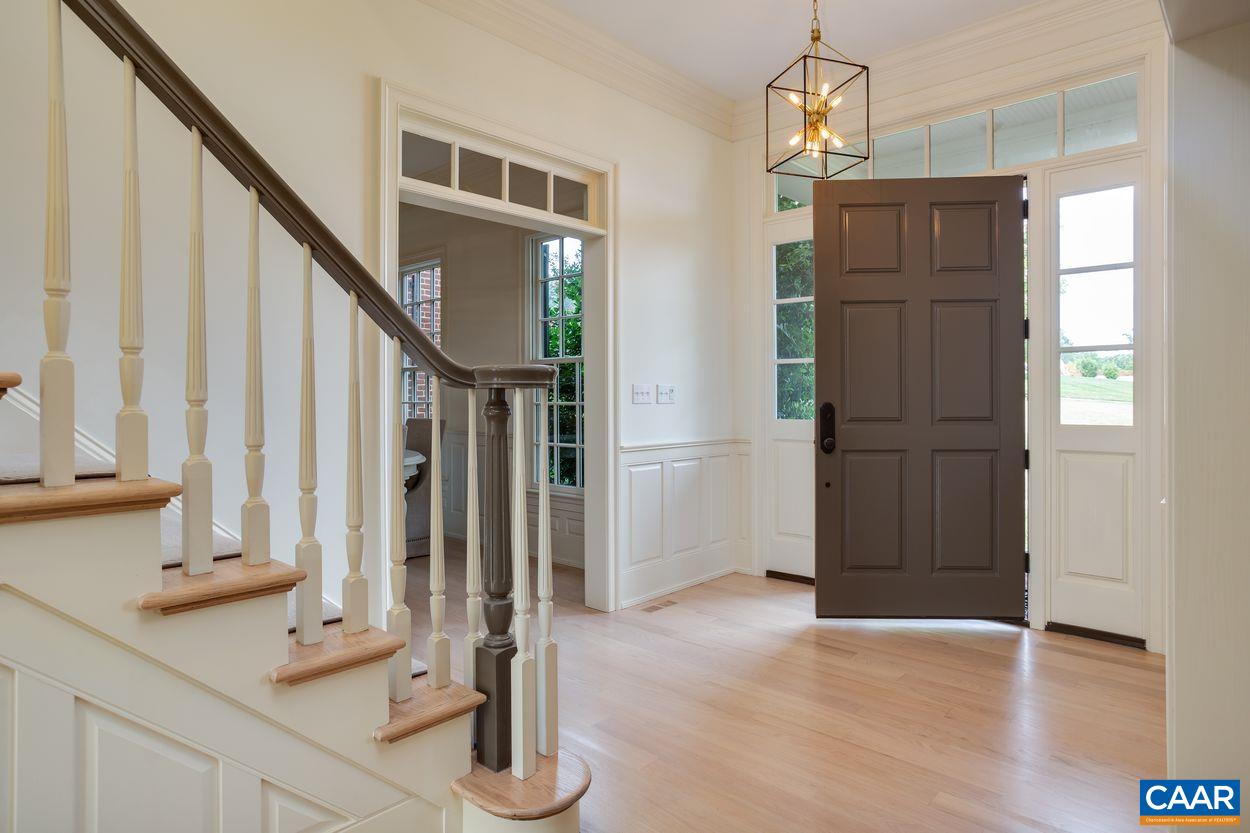 585 Ragged Mountain Drive Charlottesville, VA 22903 - Photo 2 of 60 a view of an entryway with wooden floor and staircase