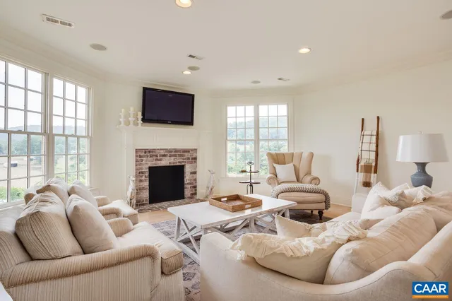 a spacious bedroom with a bed and a couch