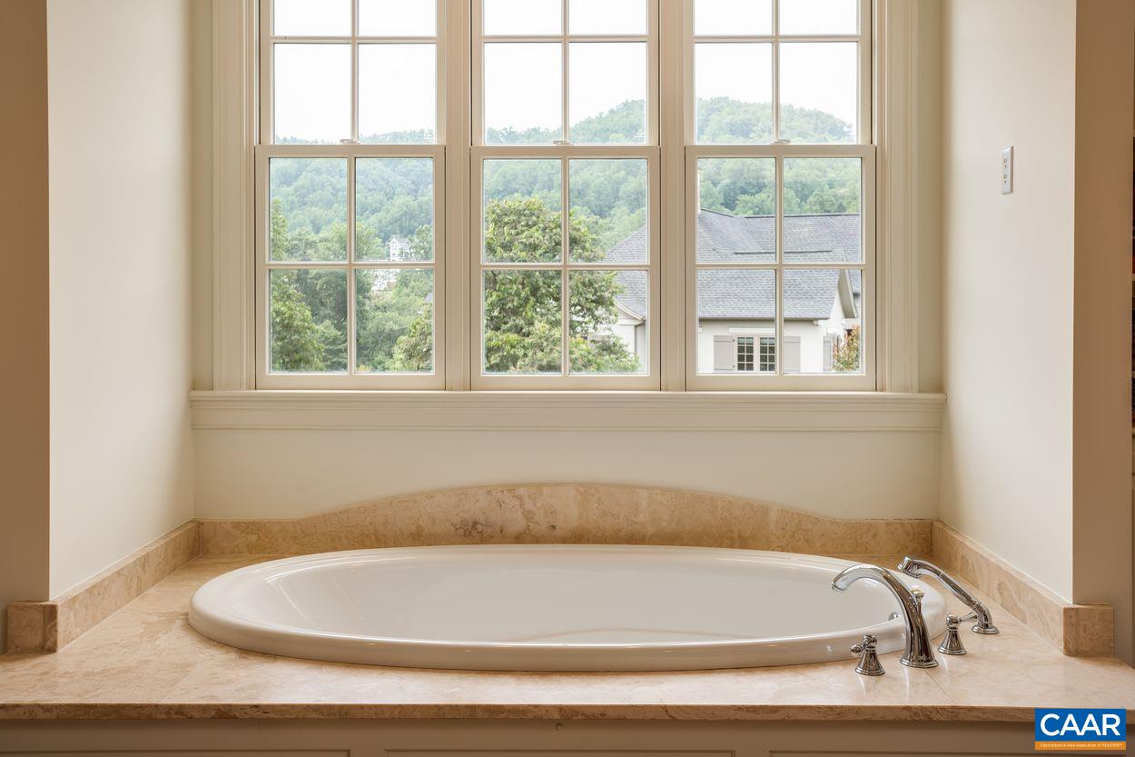 585 Ragged Mountain Drive Charlottesville, VA 22903 - Photo 31 of 60 a bathroom with bathtub and window