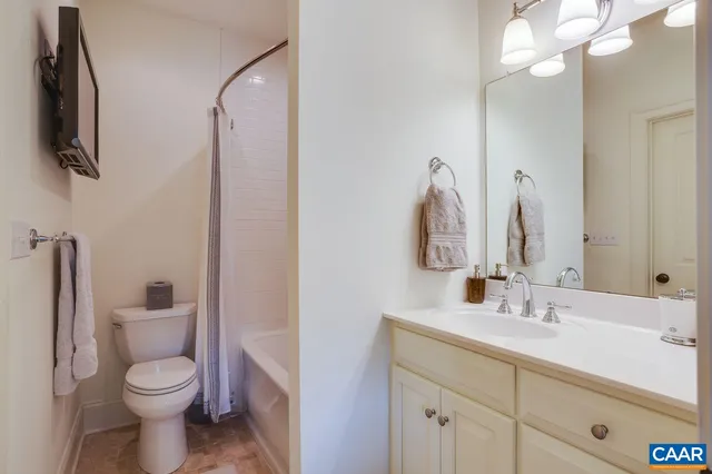 a view of a patio with couches and a potted plant