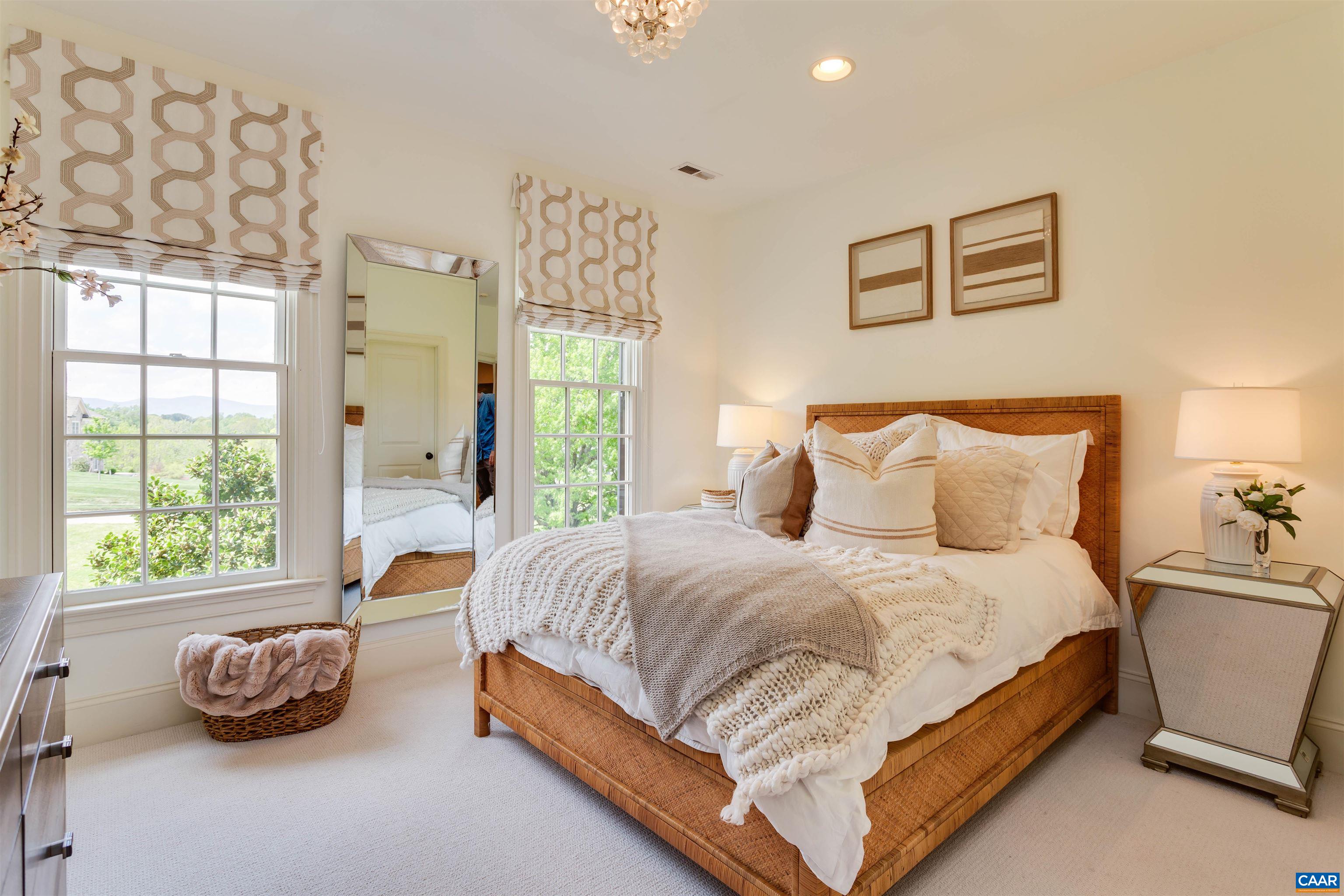 585 Ragged Mountain Drive Charlottesville, VA 22903 - Photo 36 of 60 a bedroom with a bed and a couch