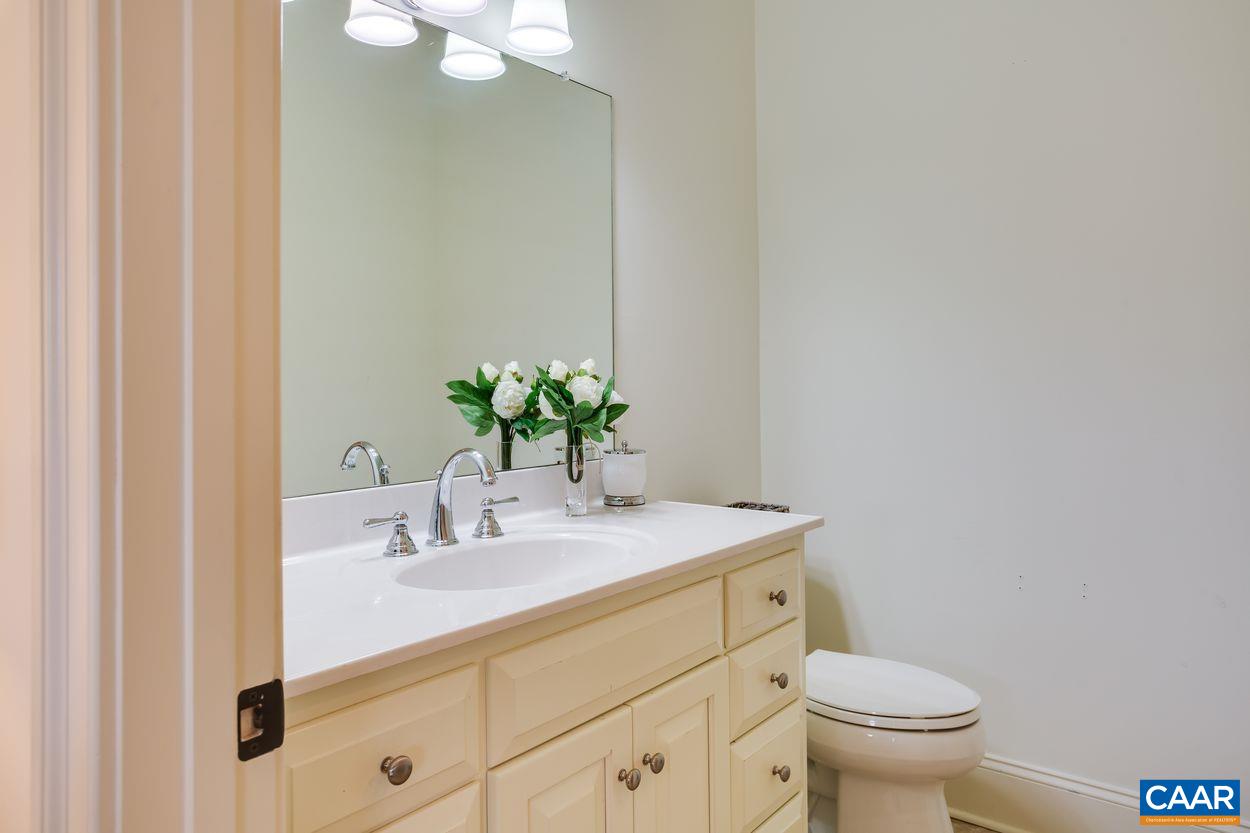 585 Ragged Mountain Drive Charlottesville, VA 22903 - Photo 38 of 60 a bathroom with a sink toilet and vanity