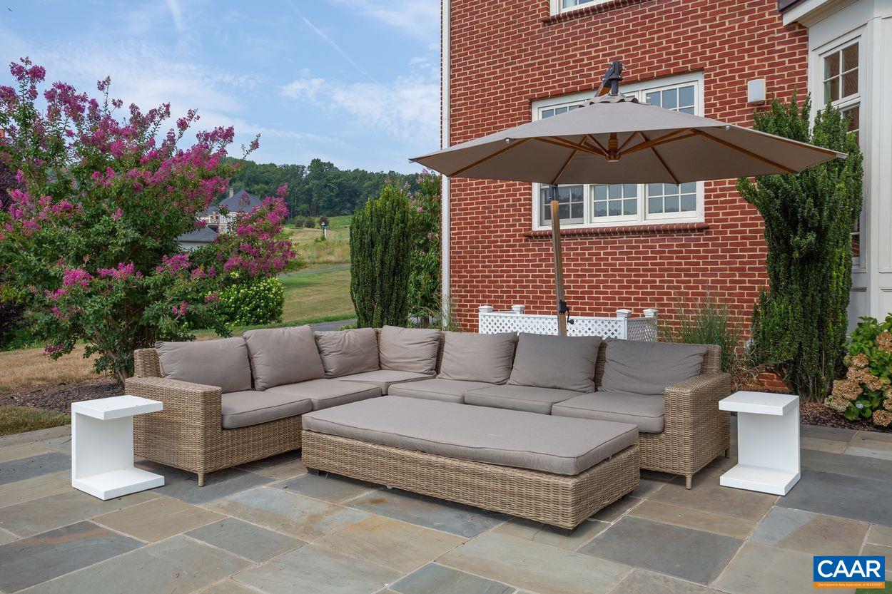 585 Ragged Mountain Drive Charlottesville, VA 22903 - Photo 42 of 60 a view of a patio with couches and a potted plant