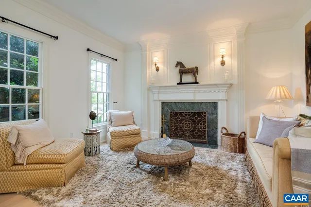 a view of a dining room with furniture and window
