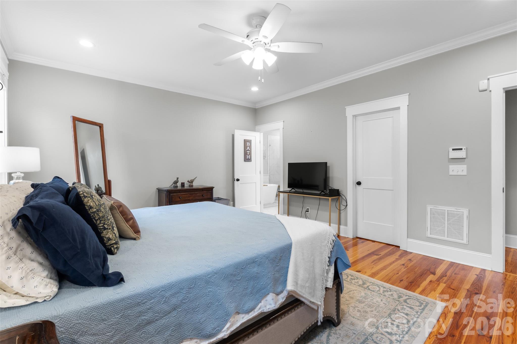 276 Belle Ridge Road Elgin, SC 29045 - Photo 17 of 45 a bedroom with a bed and a flat screen tv