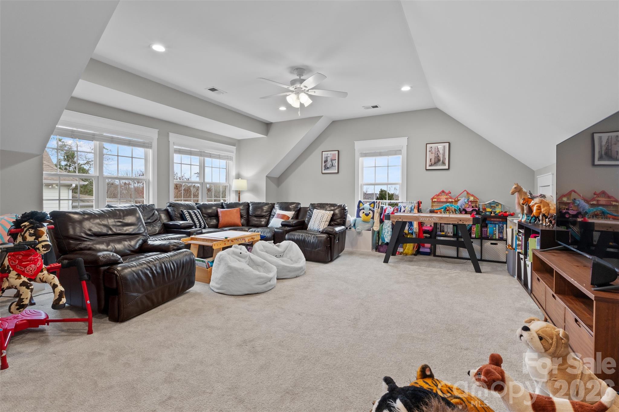 276 Belle Ridge Road Elgin, SC 29045 - Photo 28 of 45 a living room with furniture a computer on the desk and a large window