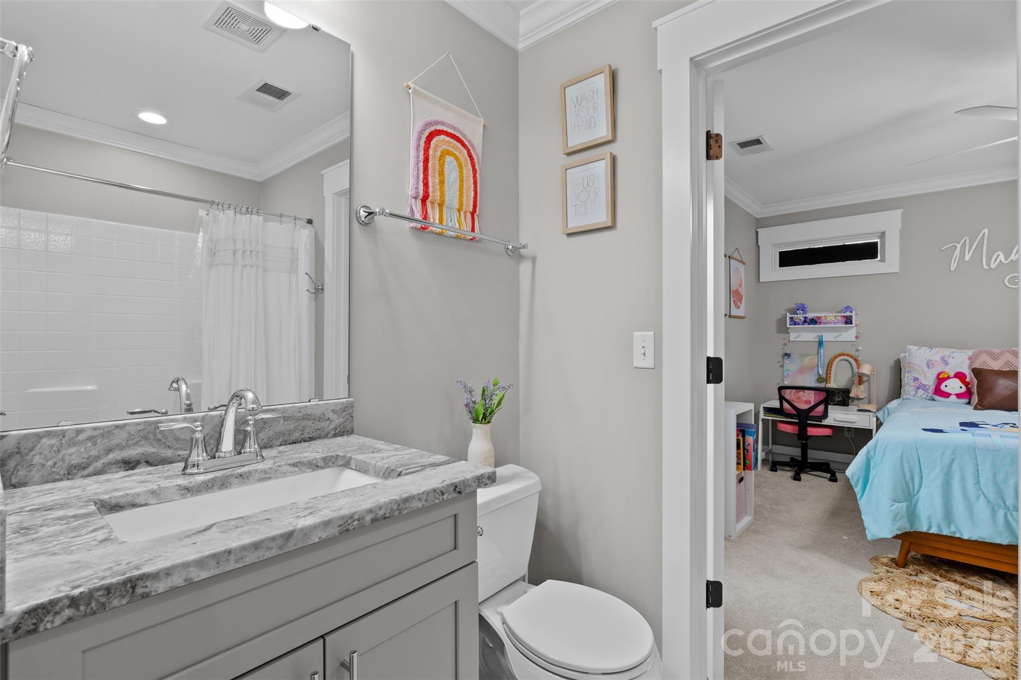 276 Belle Ridge Road Elgin, SC 29045 - Photo 38 of 45 a en suite bathroom with a granite countertop sink and a mirror