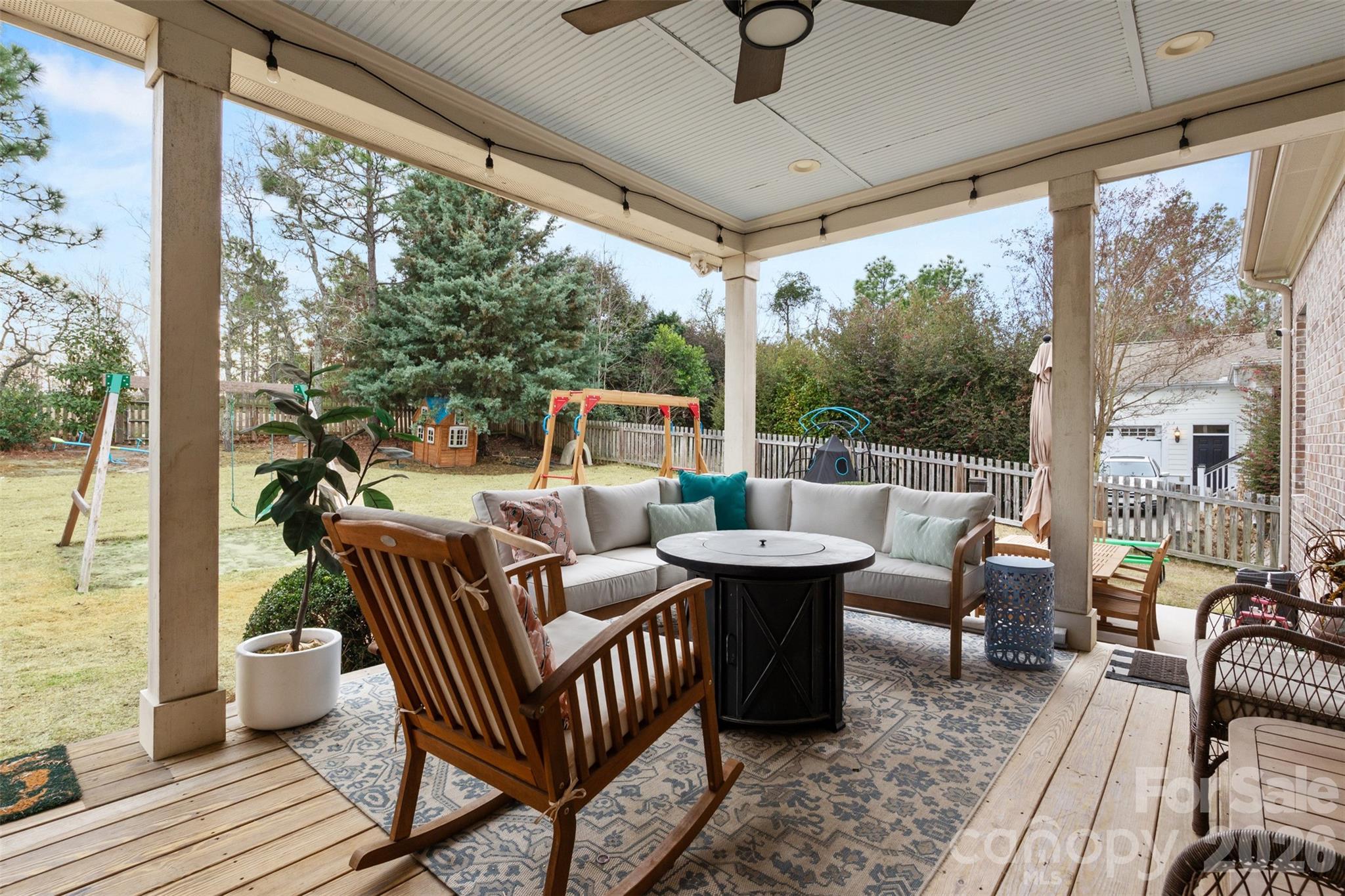 276 Belle Ridge Road Elgin, SC 29045 - Photo 39 of 45 a outdoor space with patio couch and wooden floor