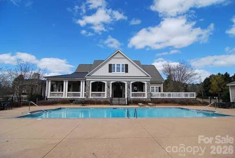 276 Belle Ridge Road Elgin, SC 29045 - Photo 44 of 45 a front view of a house with a garden and trees