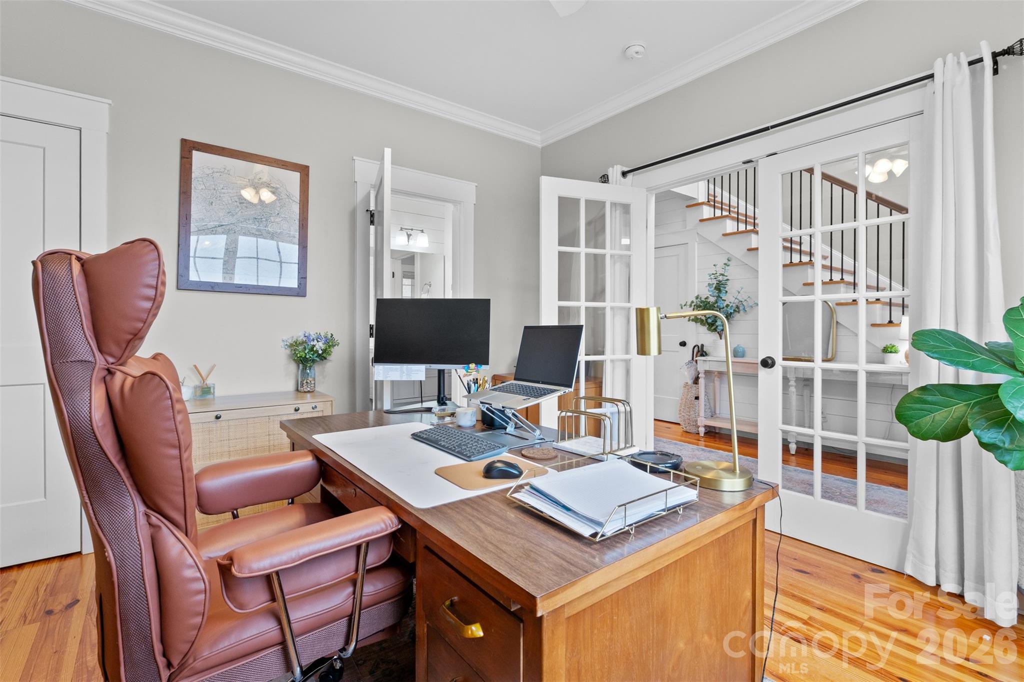 276 Belle Ridge Road Elgin, SC 29045 - Photo 5 of 45 a view of a workspace with furniture and a potted plant