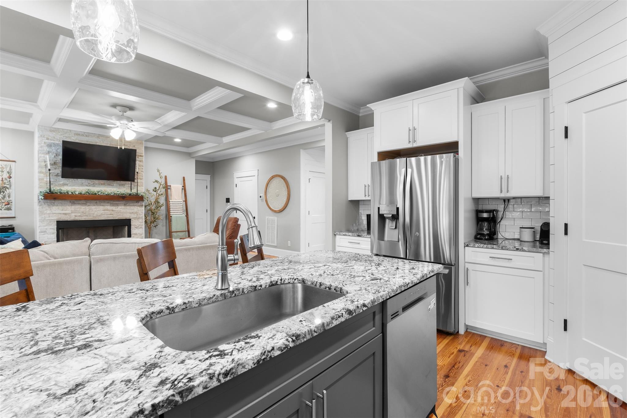 276 Belle Ridge Road Elgin, SC 29045 - Photo 10 of 45 a kitchen with stainless steel appliances granite countertop a sink and a refrigerator