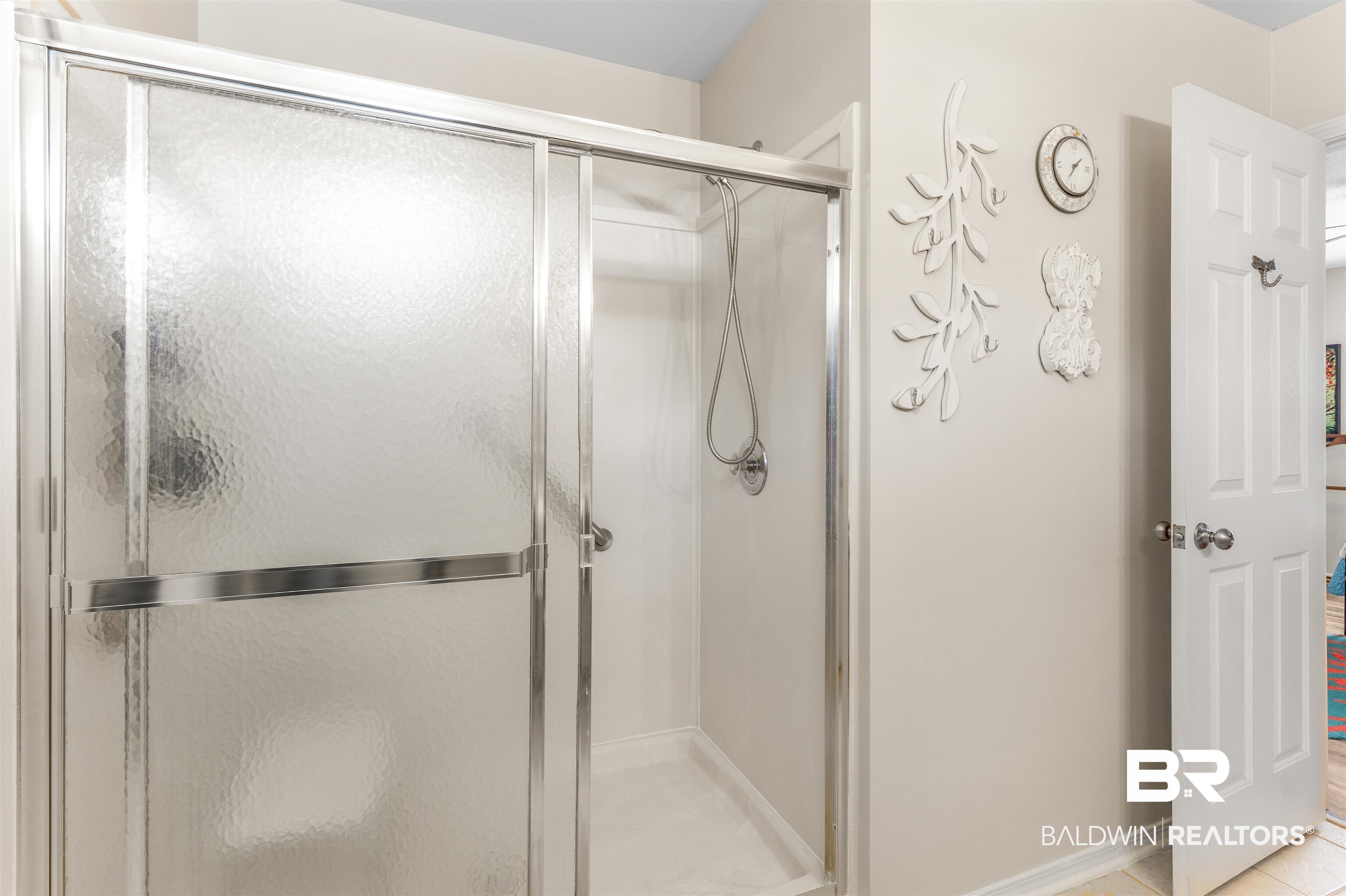 518 Ariel Avenue Foley, AL 36535 - Photo 19 of 47 Bathroom featuring ceramic tile flooring and an enclosed shower with a tub.