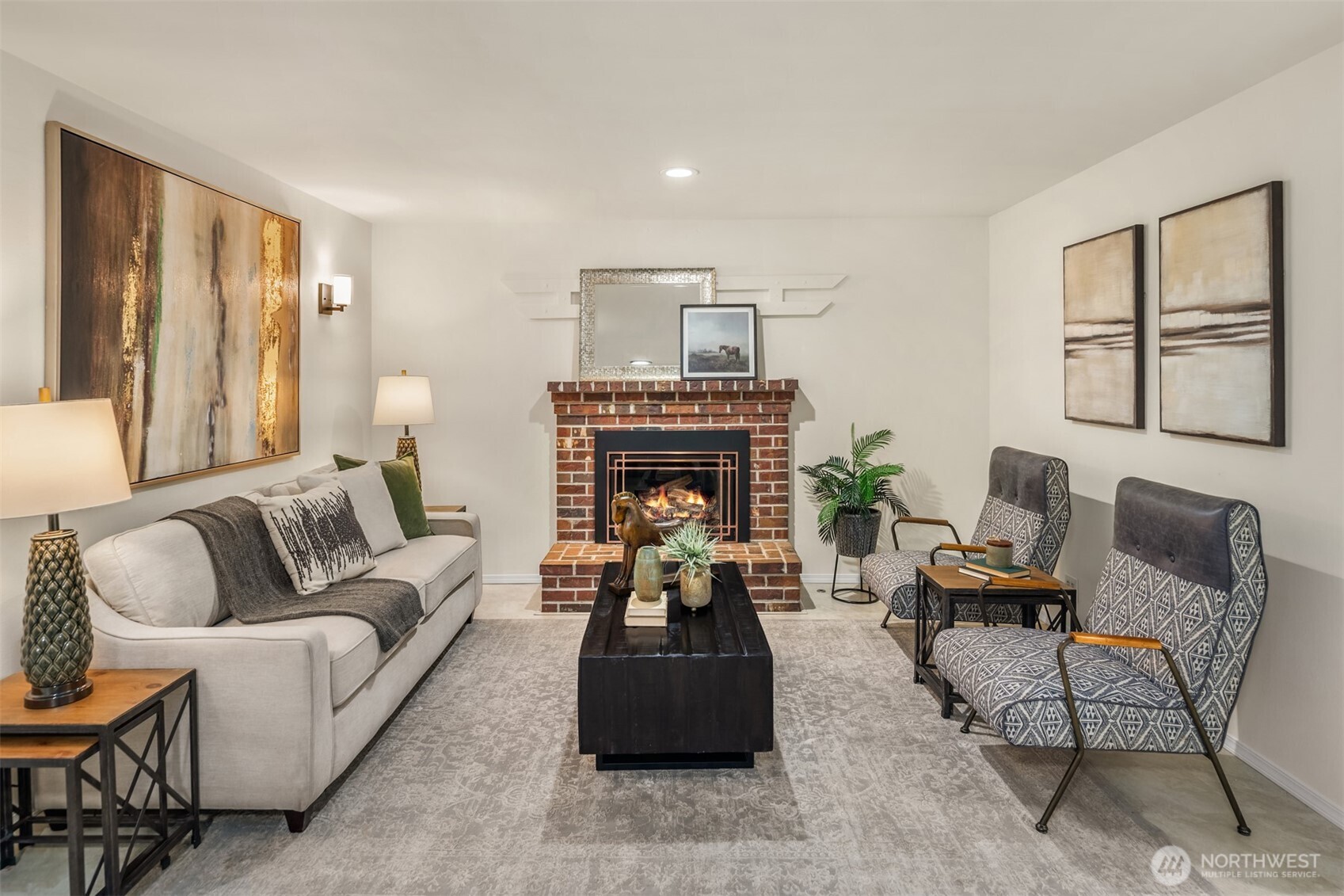 1425 243rd Place Southwest Bothell, WA 98021 - Photo 12 of 39 a living room with furniture and a fireplace