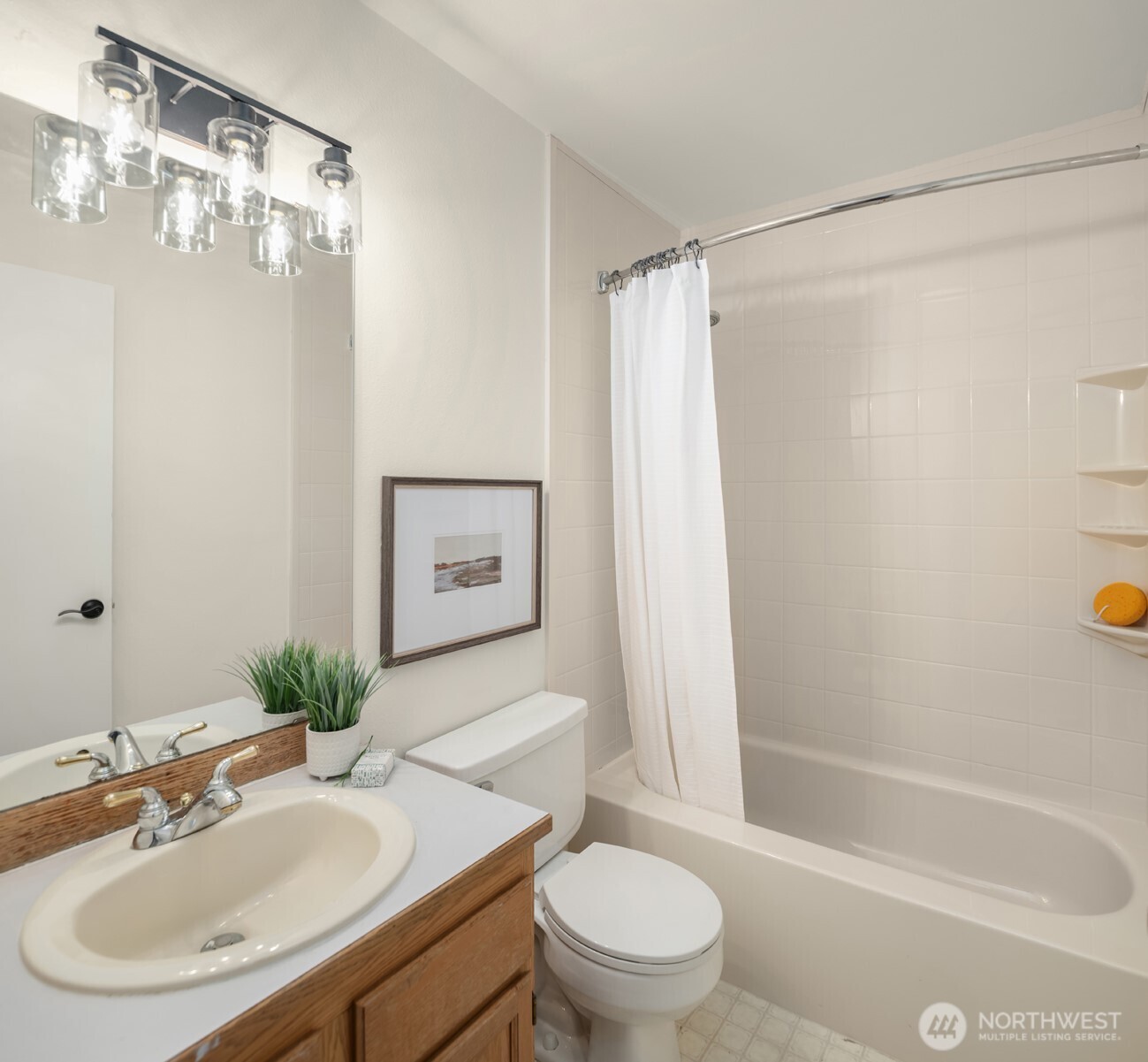 1425 243rd Place Southwest Bothell, WA 98021 - Photo 23 of 39 a bathroom with a sink toilet and shower