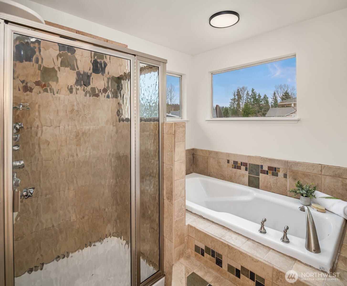 1425 243rd Place Southwest Bothell, WA 98021 - Photo 26 of 39 a bathroom with a tub and a shower