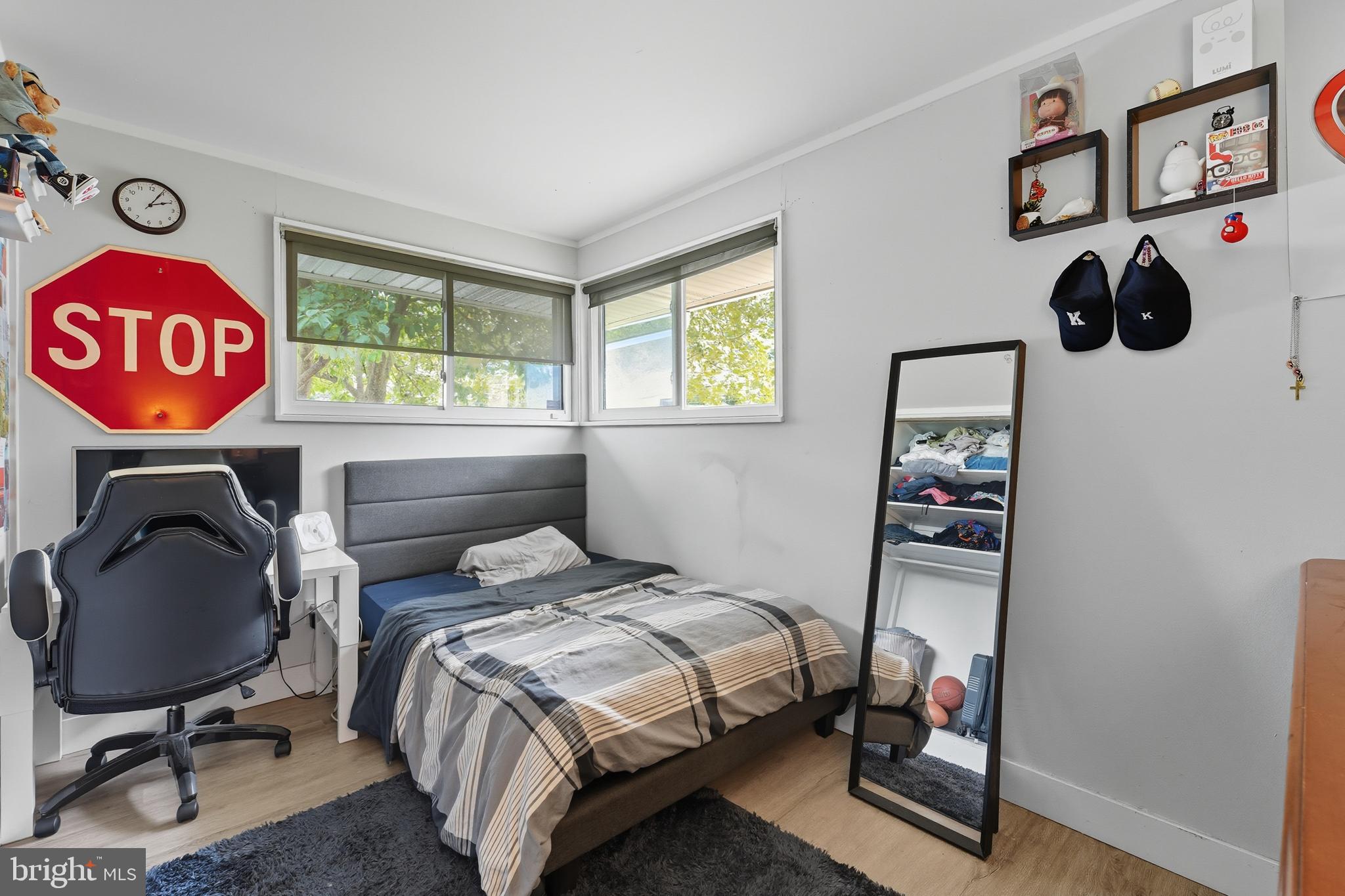 7626 Greenleaf Road Landover, MD 20785 - Photo 13 of 24 a bedroom with a bed and a window