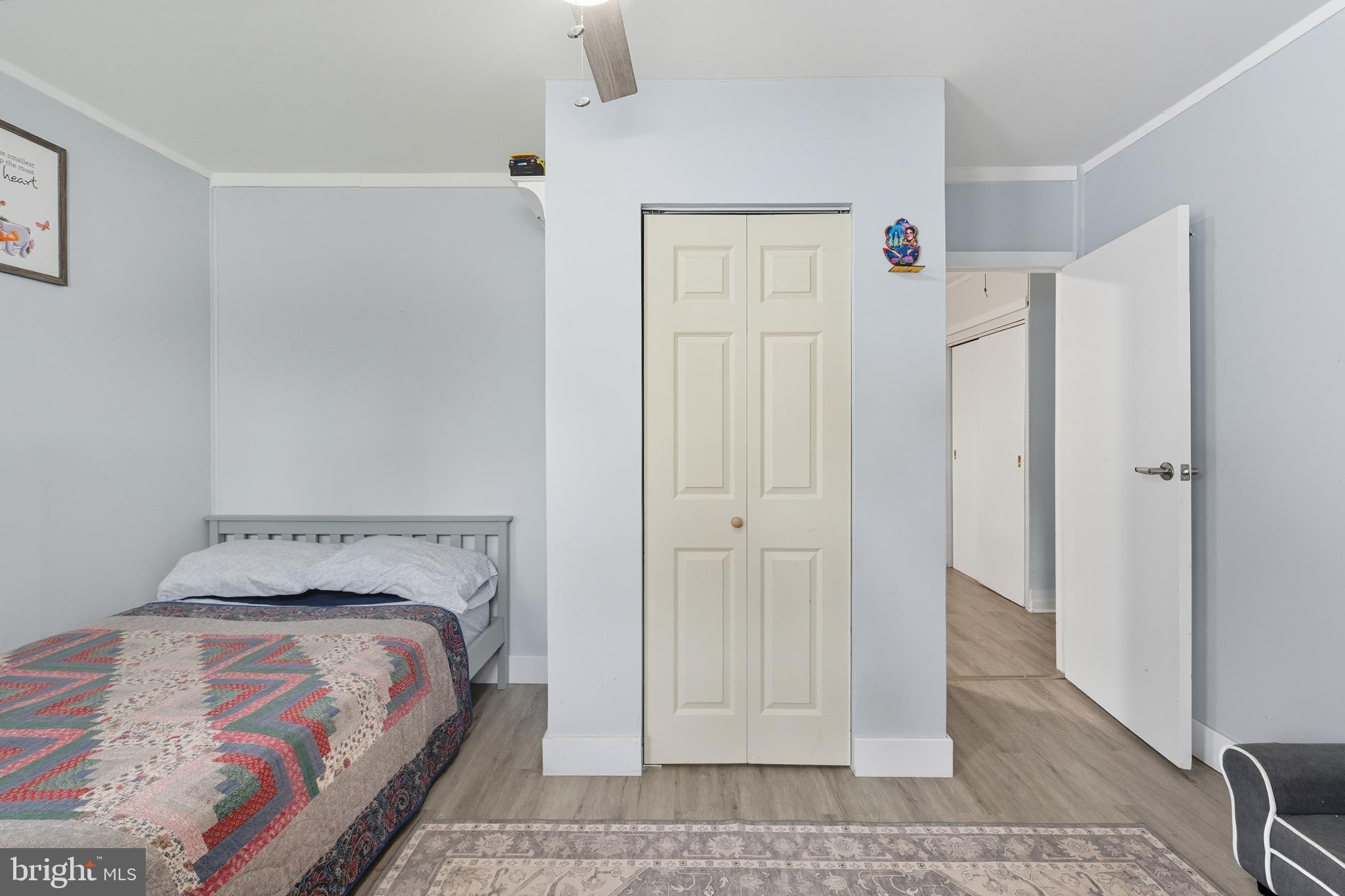 7626 Greenleaf Road Landover, MD 20785 - Photo 14 of 24 a bedroom with a bed and a rug