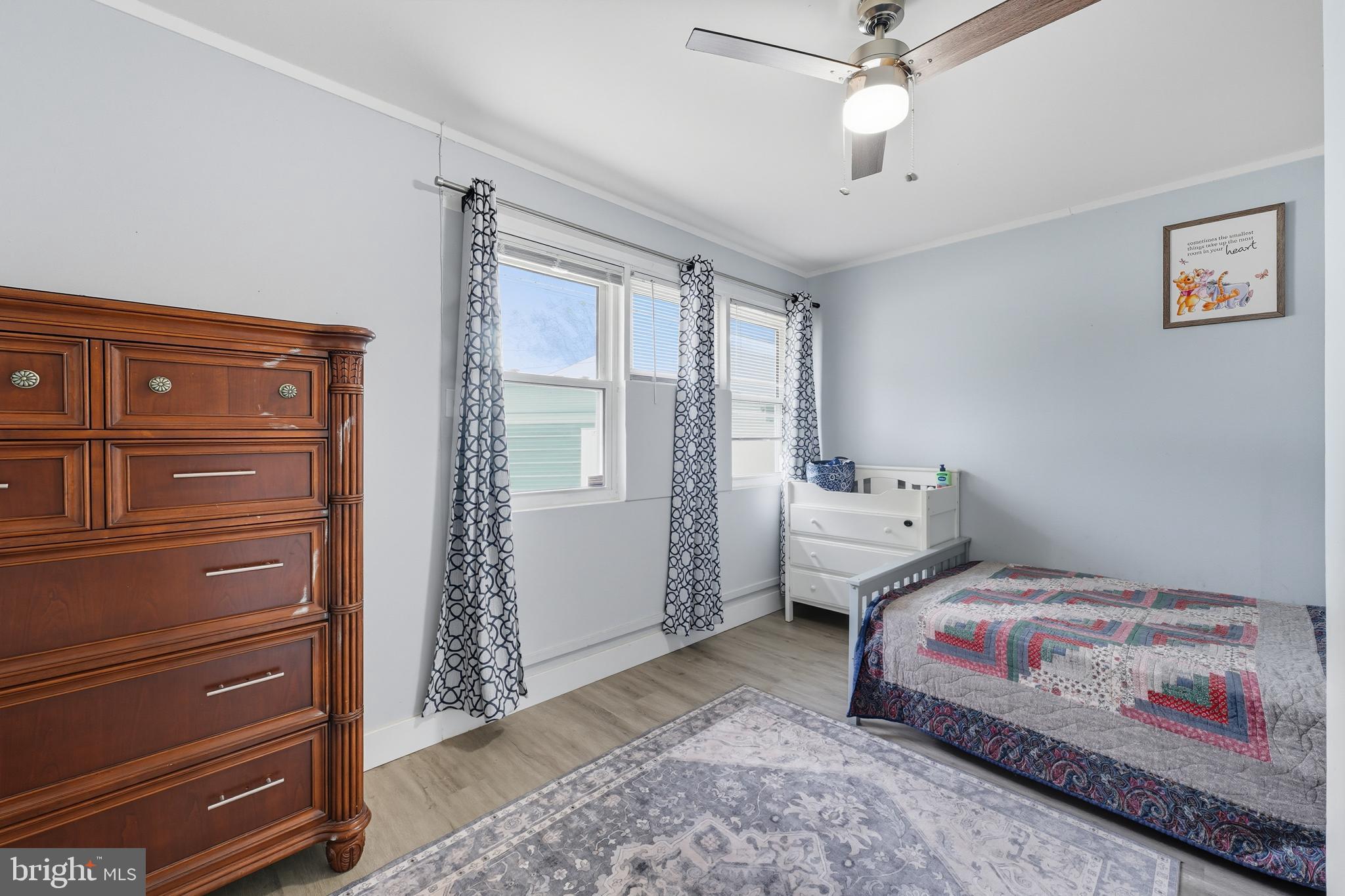7626 Greenleaf Road Landover, MD 20785 - Photo 15 of 24 a bedroom with a bed and a dresser