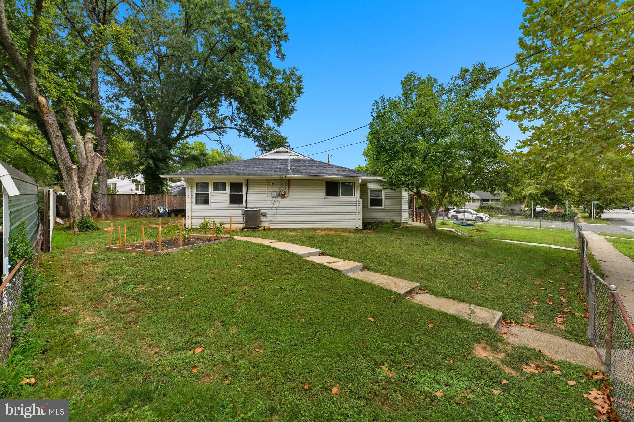 7626 Greenleaf Road Landover, MD 20785 - Photo 19 of 24 a front view of a house with a garden