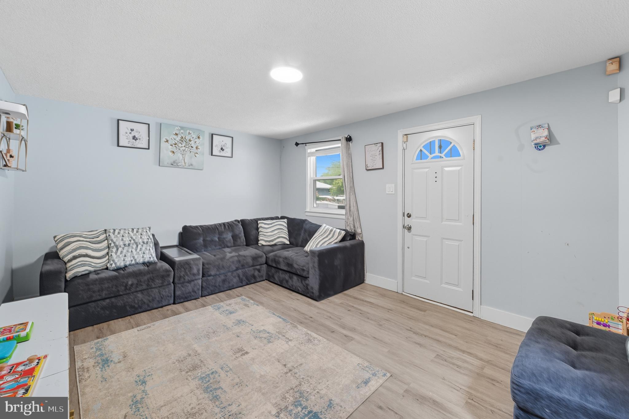 7626 Greenleaf Road Landover, MD 20785 - Photo 2 of 24 a living room with furniture and a couch