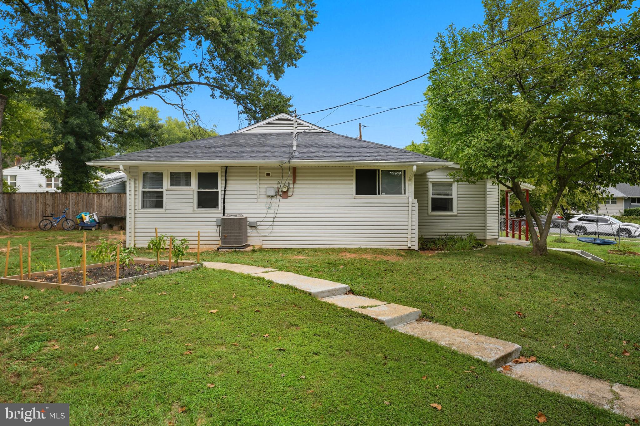 7626 Greenleaf Road Landover, MD 20785 - Photo 22 of 24 a backyard of a house with table and chairs