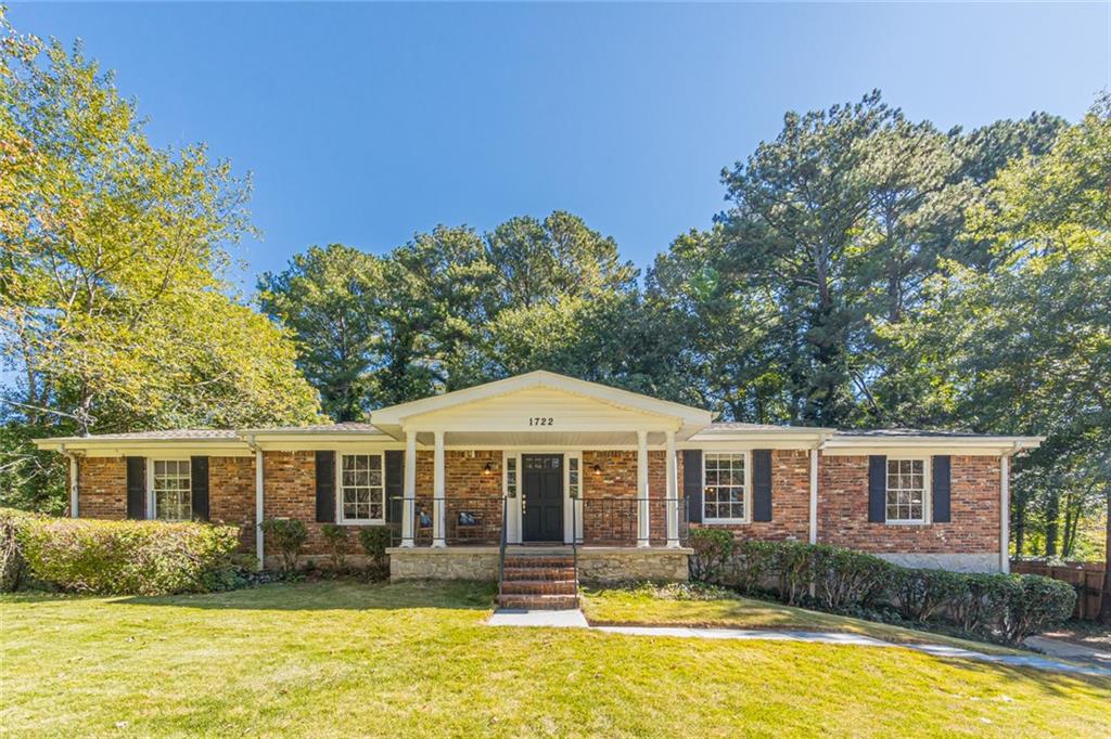 a front view of a house with a yard table and chairs