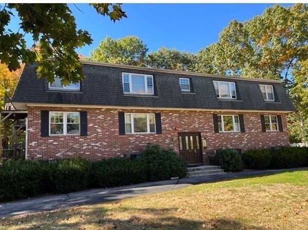 29 Sherman Street, Unit 1 Foxboro, MA 02035 - Photo 1 of 16 a front view of a house with a yard