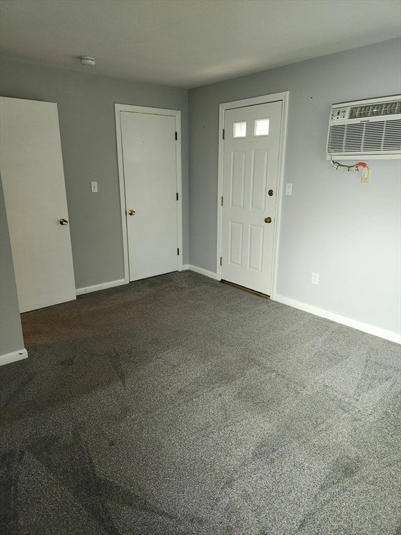 29 Sherman Street, Unit 1 Foxboro, MA 02035 - Photo 11 of 16 an empty room with closet and wooden floor