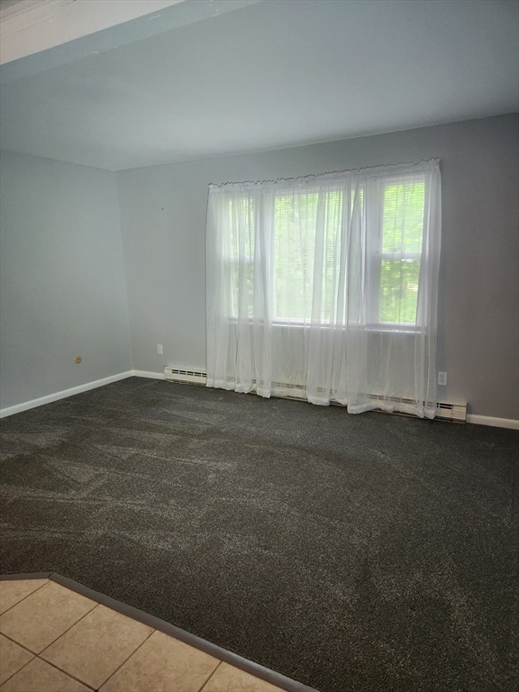 29 Sherman Street, Unit 1 Foxboro, MA 02035 - Photo 5 of 16 an empty room with a window