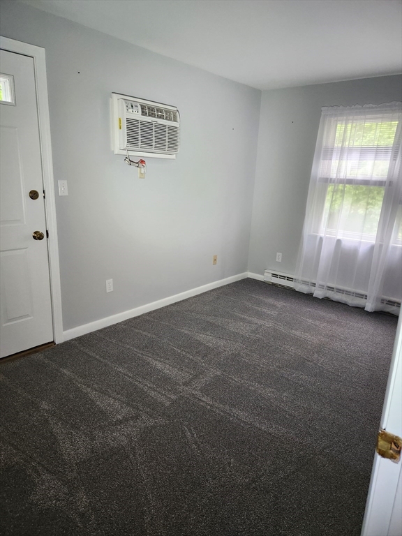 29 Sherman Street, Unit 1 Foxboro, MA 02035 - Photo 9 of 16 an empty room with a window