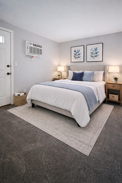 29 Sherman Street, Unit 1 Foxboro, MA 02035 - Photo 10 of 16 a spacious bedroom with a bed and a couch