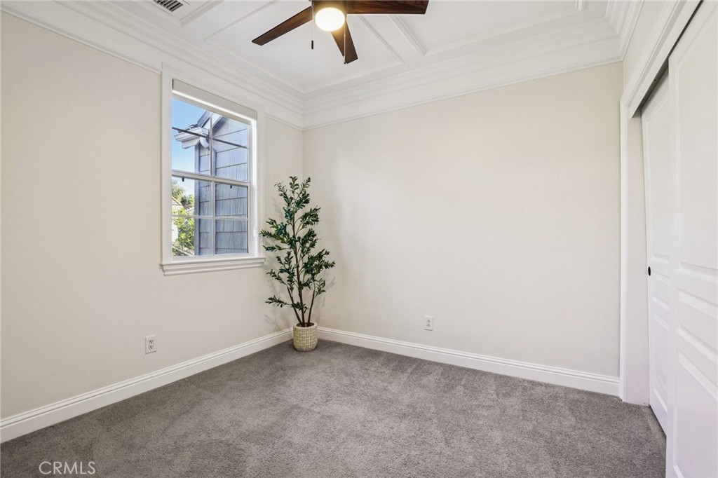 15 Whitworth Street Ladera Ranch, CA 92694 - Photo 21 of 57 an empty room with windows and potted plant