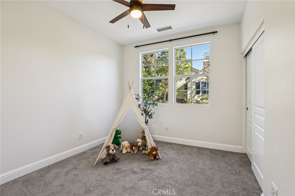 15 Whitworth Street Ladera Ranch, CA 92694 - Photo 23 of 57 a room with gym equipment and a large window