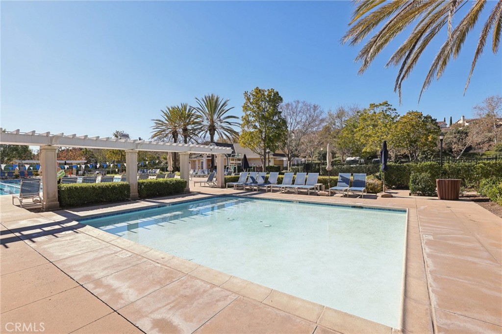 15 Whitworth Street Ladera Ranch, CA 92694 - Photo 38 of 57 a view of a swimming pool with a lounge chairs