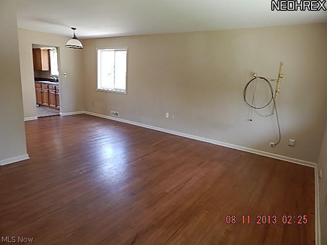 8215-8217 Reed Avenue Garfield Heights, OH 44125 - Photo 3 of 11 SPACIOUS LIVINGROOM WITH DINETTE AREA