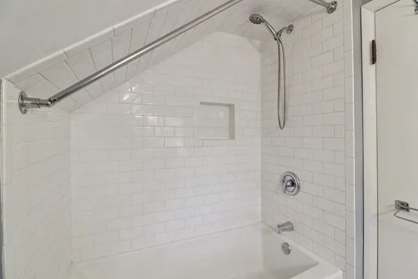 a bathroom with a shower and a shower