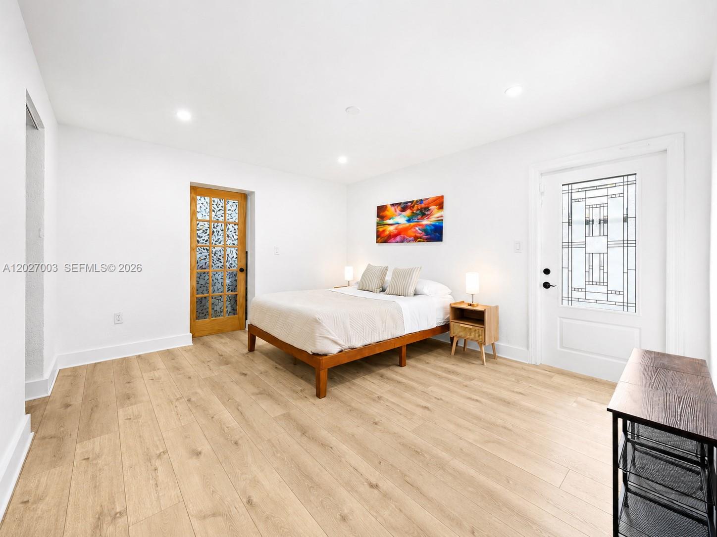 2761 Southwest 92nd Place Miami, FL 33165 - Photo 13 of 37 a bedroom with a bed and a table